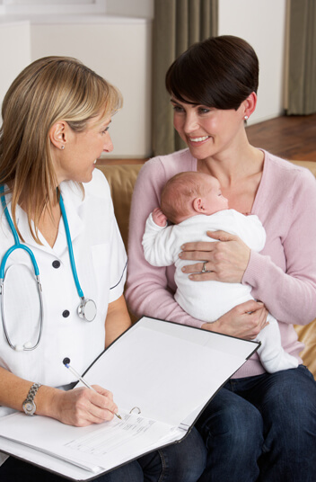 A lady with her child on doctor's consultation