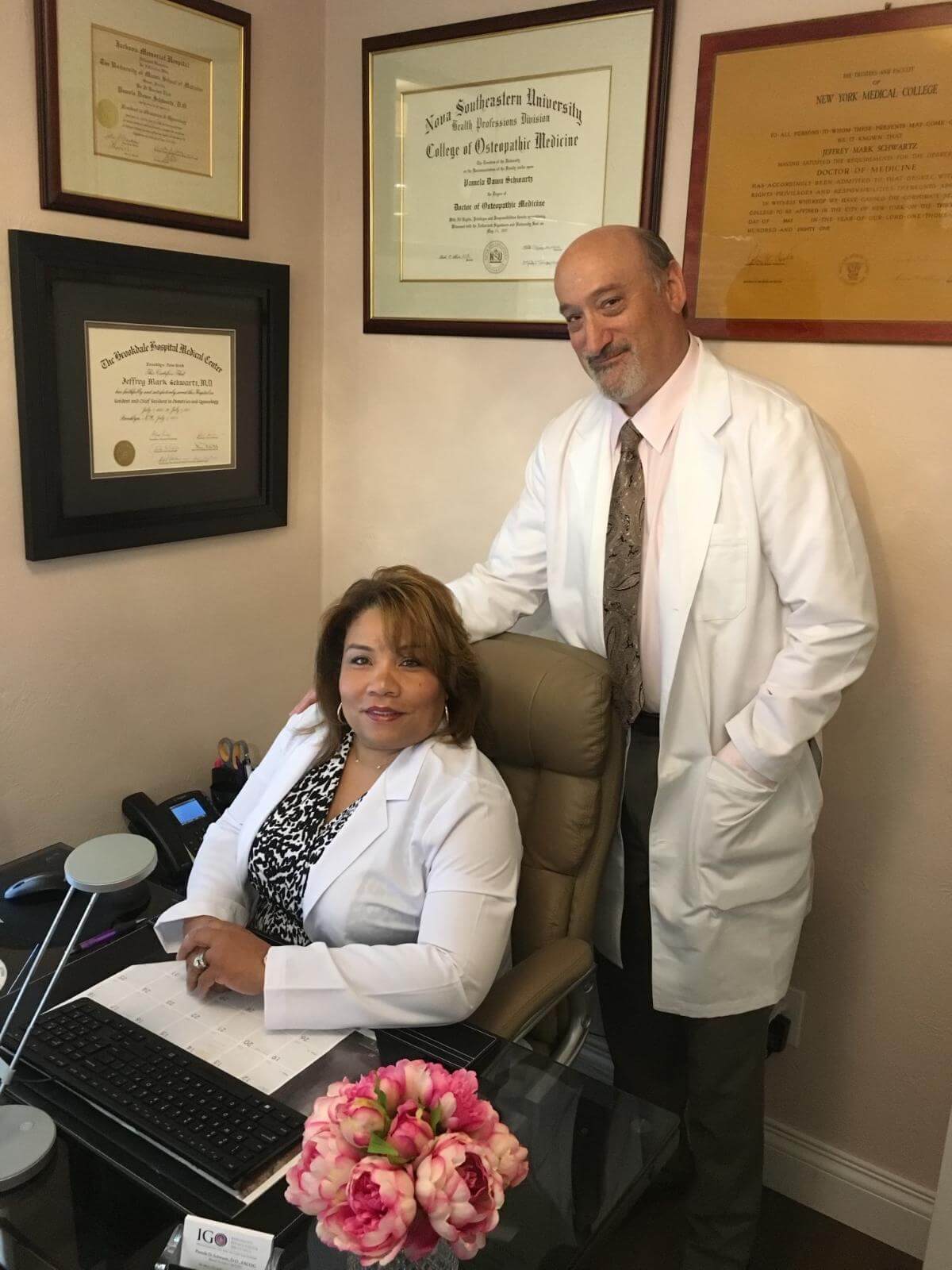 lady doctor discussing report with Couple